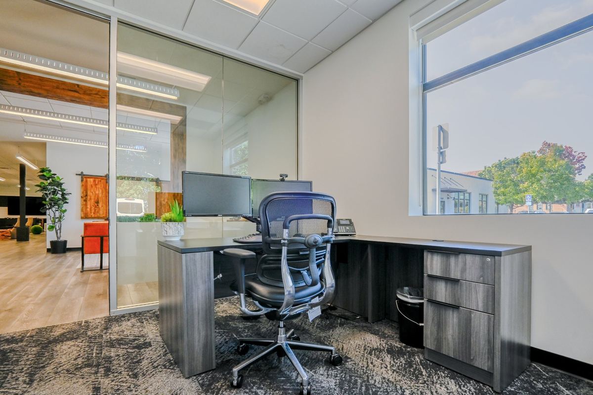 The Gallery suite: a glass wall onto the lounge and a full L-shaped desk