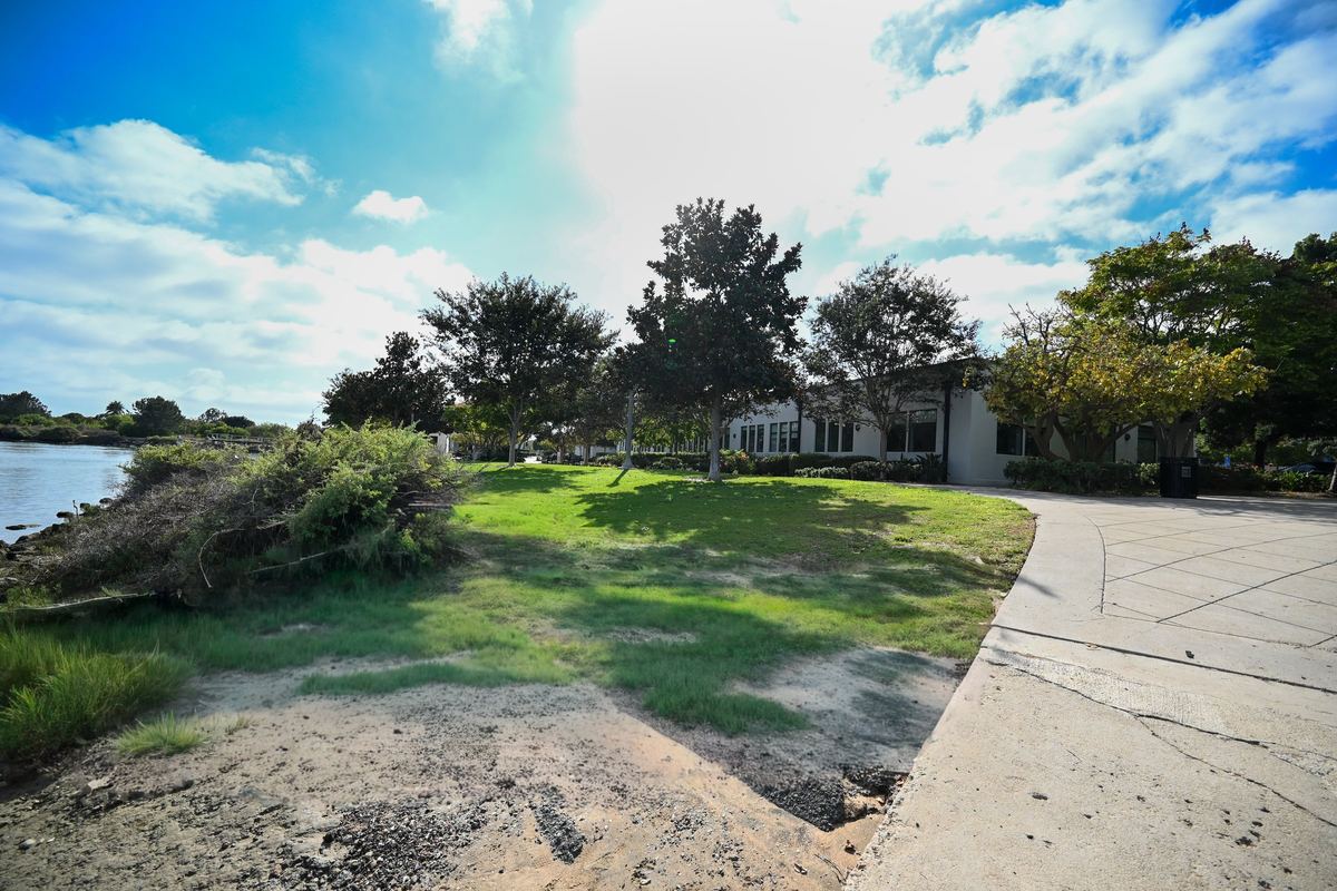 The lawn and boat channel beside the building at Liberty Station